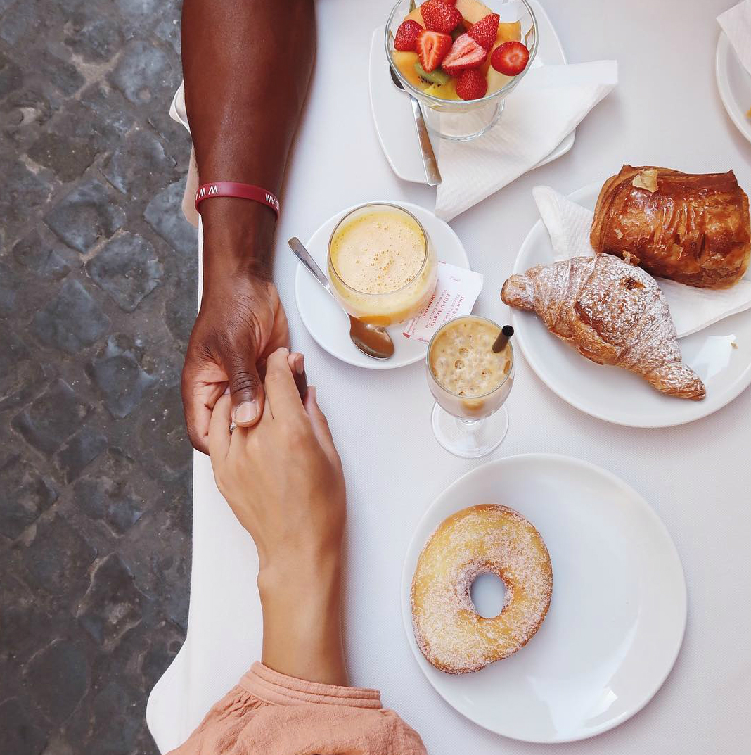 Couple holding hands at cafe - Black Love