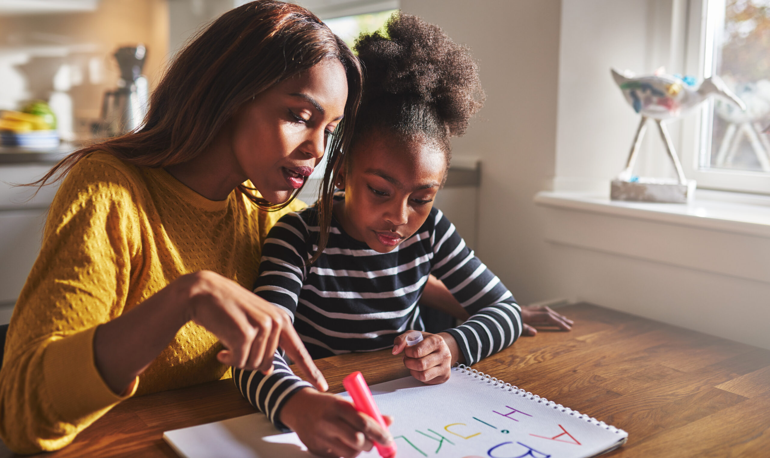 Mother and child schoolwork - Black Love Credit: ShutterStock