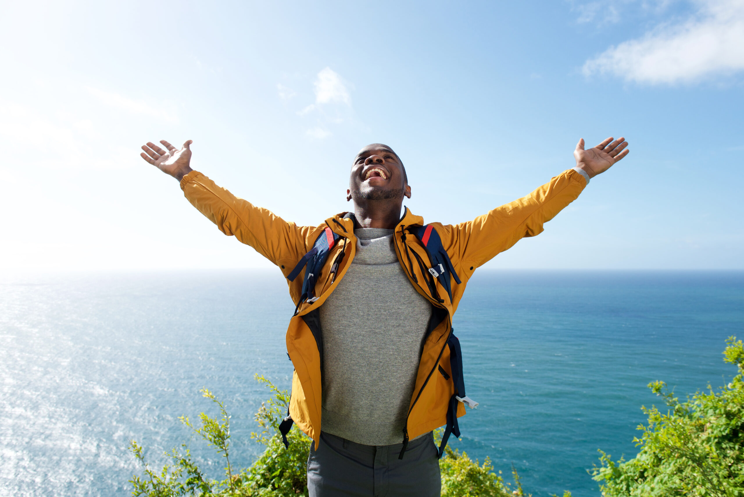 Man standing with arms outstreched - Black Love Courtesy of Shutterstock