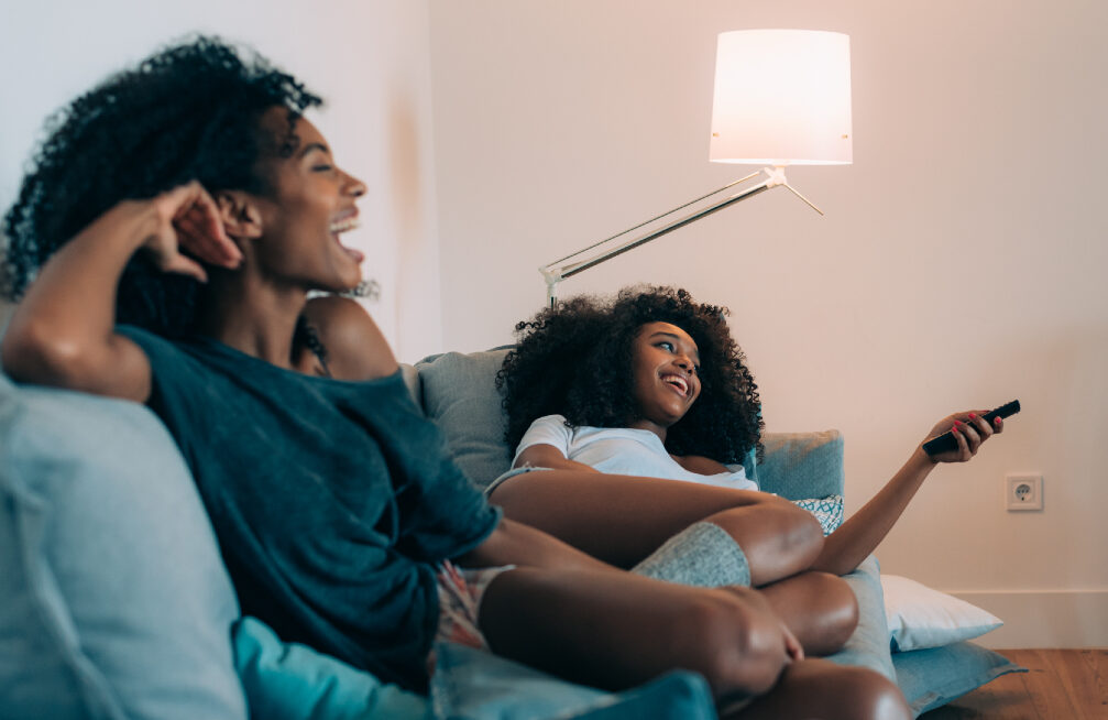 Women watching TV. (Photo courtesy of Shutterstock.com) - Black Love Women watching TV. (Photo courtesy of Shutterstock.com)