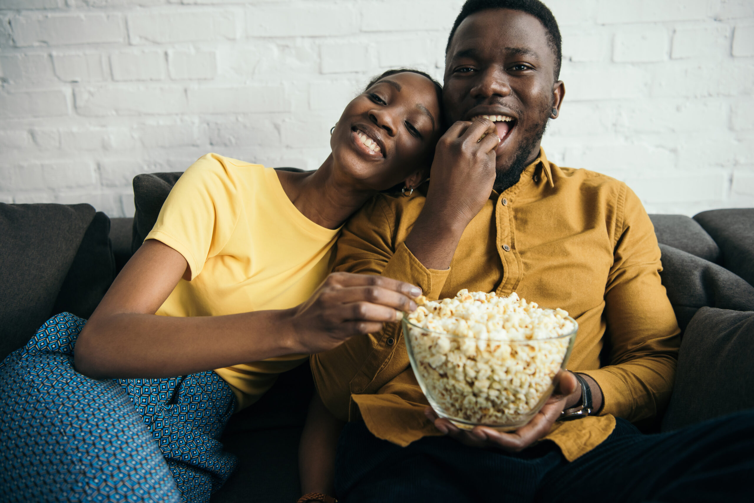 Couple watching TV. (Photo courtesy of Shutterstock.com) - Black Love Couple watching TV. (Photo courtesy of Shutterstock.com)