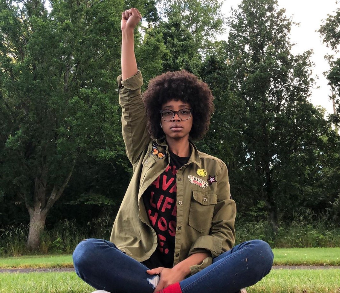 Photo courtesy of Instagram/@RhyanMichele/@Cinemanshots - Black Love Black power fist
