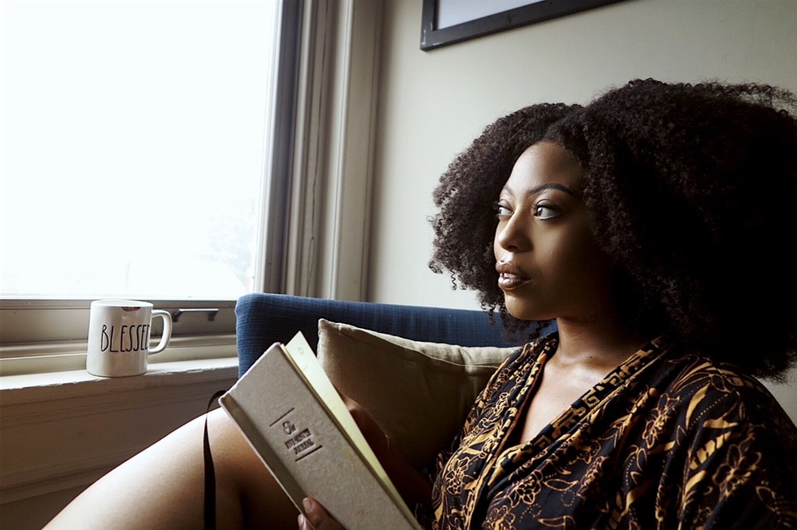 Woman writing (Photo courtesy of Ayana Iman)