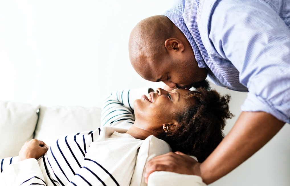 Man kissing woman on forehead (Photo courtesy of rawpixel.com) - Black Love Man kissing woman on forehead (Photo courtesy of rawpixel.com)