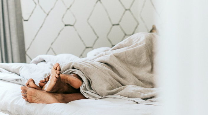 Couple in bed (Photo courtesy of Rawpixel.com)