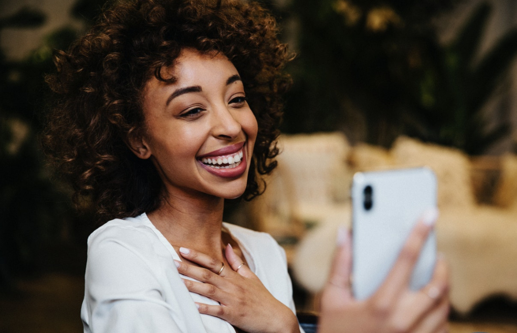 Courtesy of rawpixel.com - Black Love Woman on phone (Courtesy of rawpixel.com)