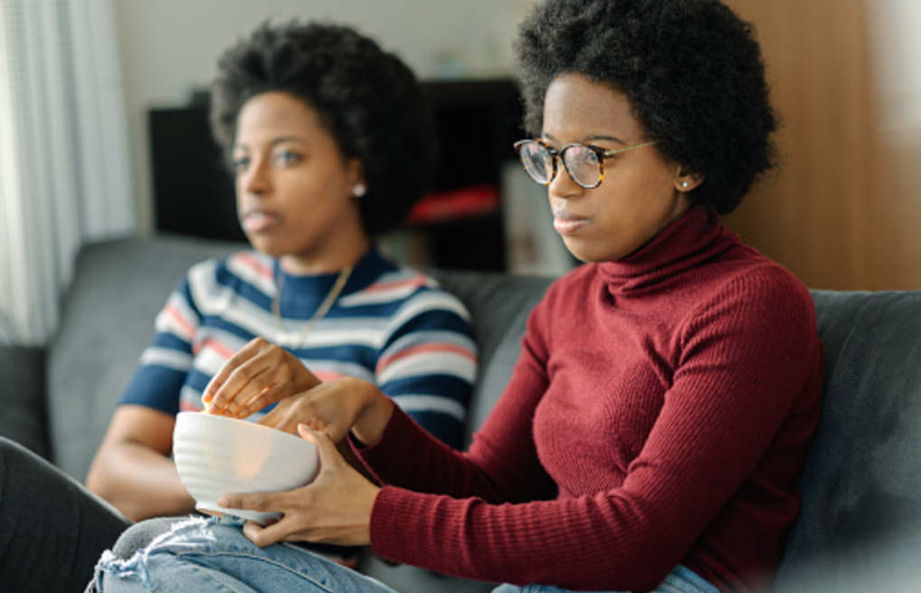 Credit: iStock - Black Love Friends watching tv (Credit: iStock)