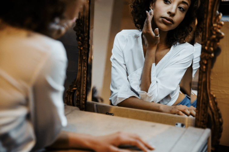 Courtesy of rawpixel.com - Black Love Woman looking at mirror