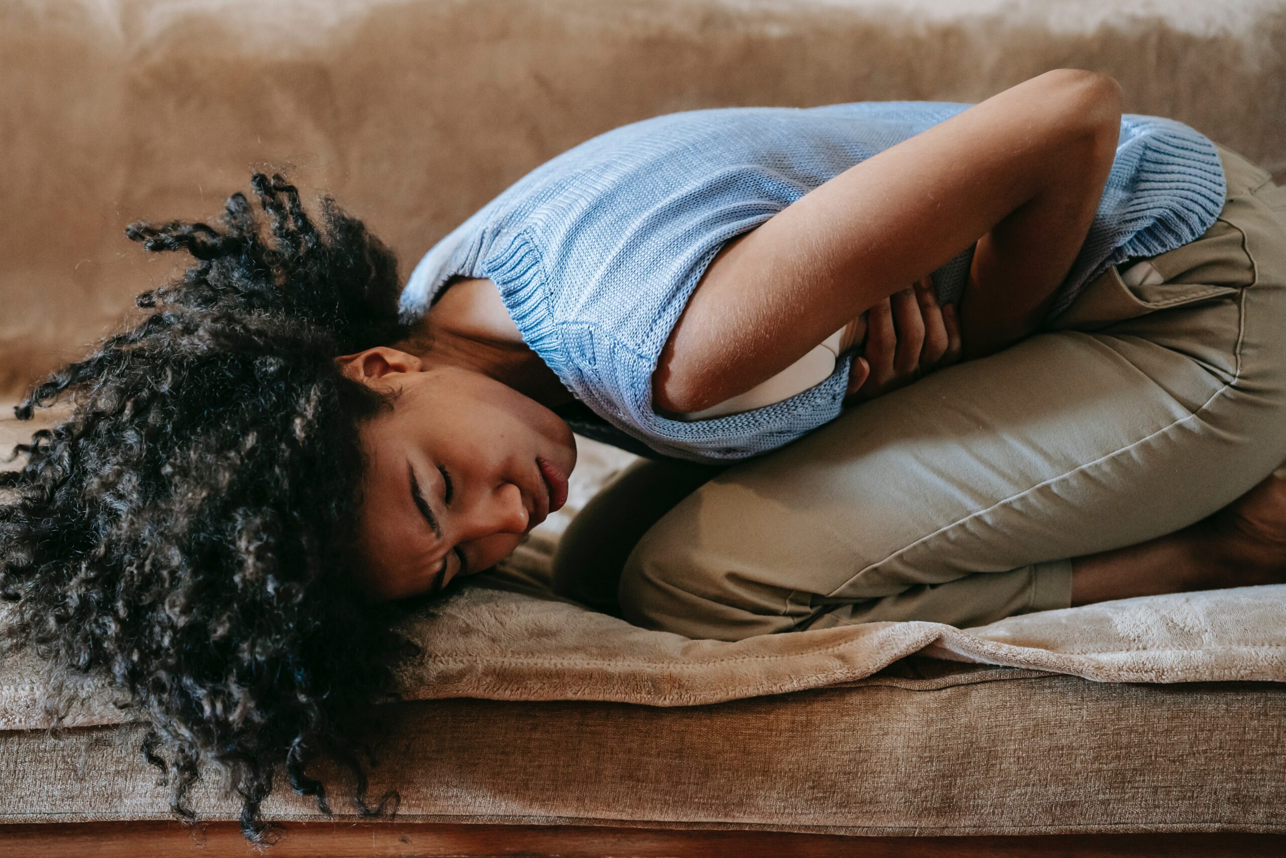 Woman hunched over in pain (Courtesy of Pexels.com) - Black Love Woman hunched over in pain (Courtesy of Pexels.com)
