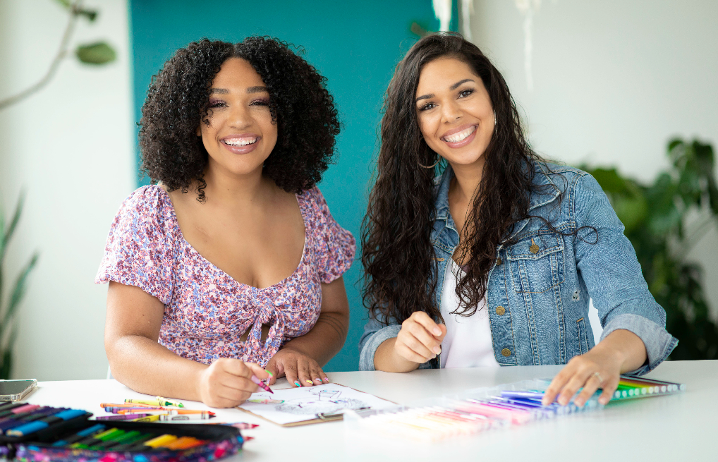 Meet The Two Sisters Filling the Coloring Book Space With Black Curl Magic