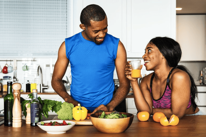 Couple cooking healthy food in the kitchen (Courtesy of rawpixel.com)
