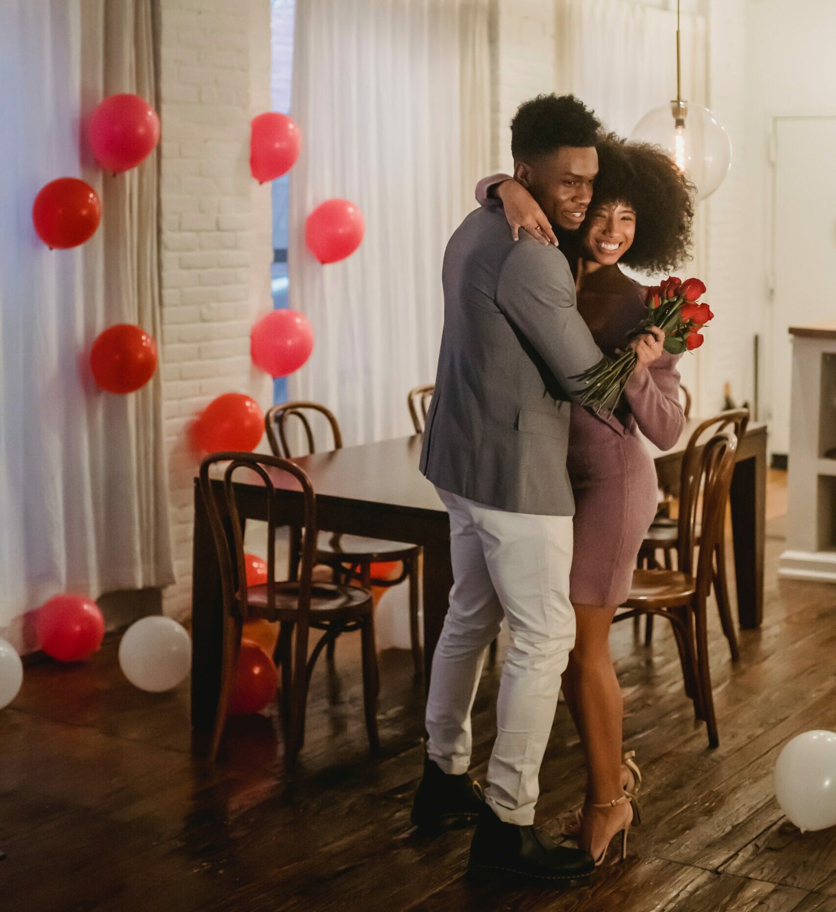 Courtesy of pexels.com - Black Love Man giving woman flowers (Courtesy of pexels.com)