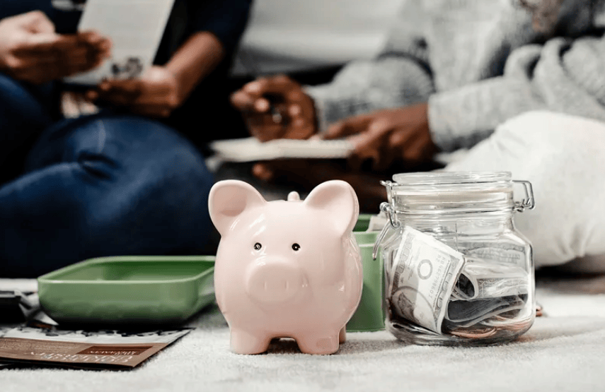 Courtesy of rawpixel.com - Black Love Man and woman with piggy bank