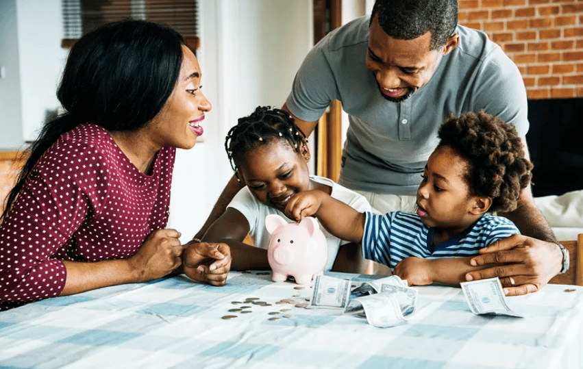 Courtesy of rawpixel.com - Black Love Family with piggy bank