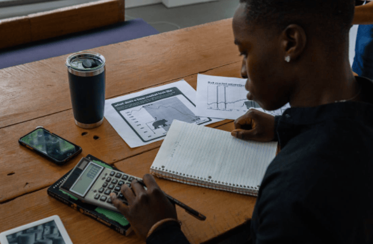 Courtesy of pexels.com - Black Love Man using calculator