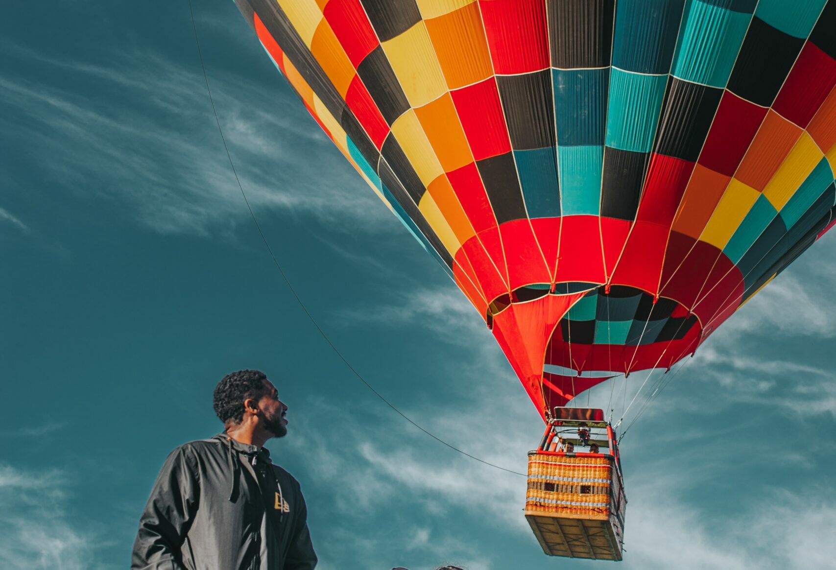 pexels-alessandro-kelvin-2376268 - Black Love Man looking at a hot air balloon