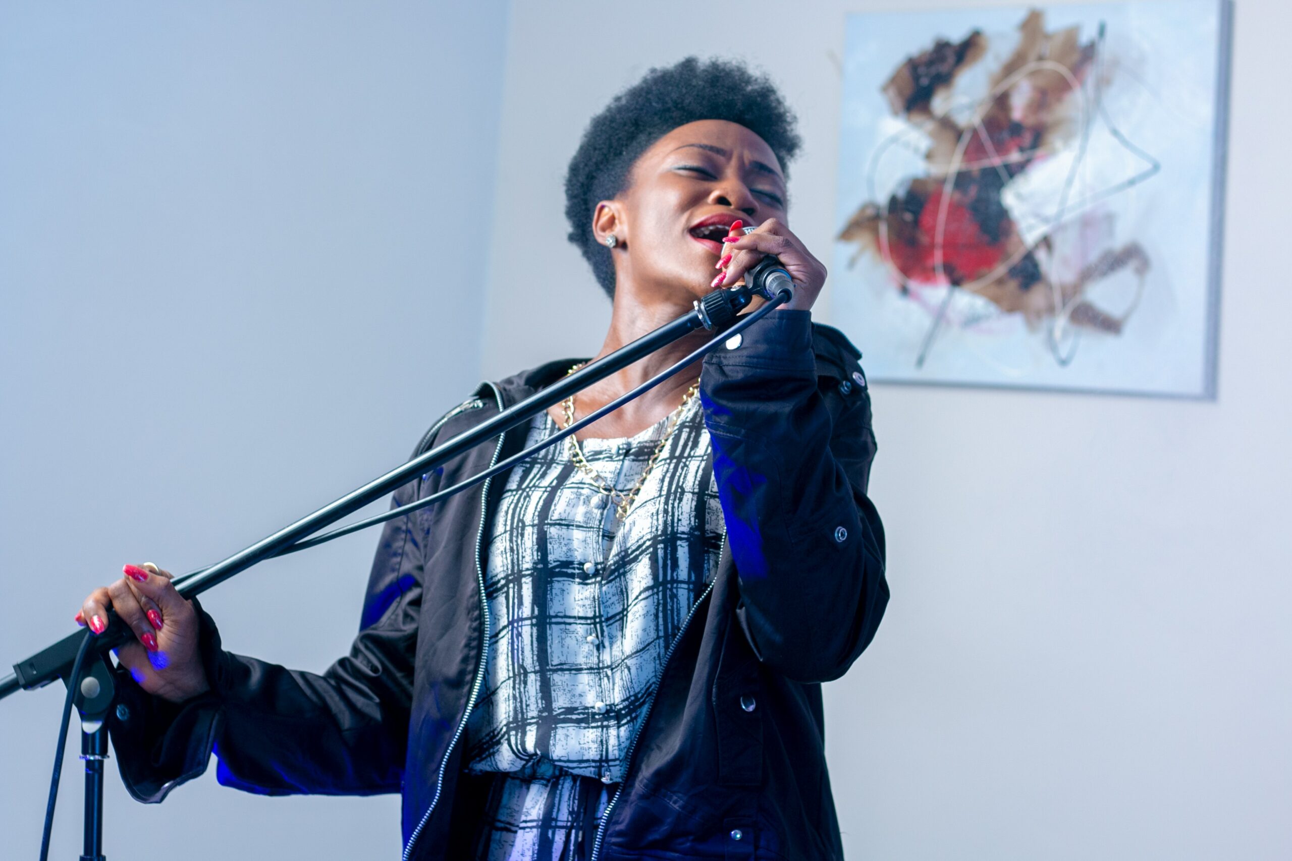 Courtesy of pexels.com - Black Love Woman singing into a mic