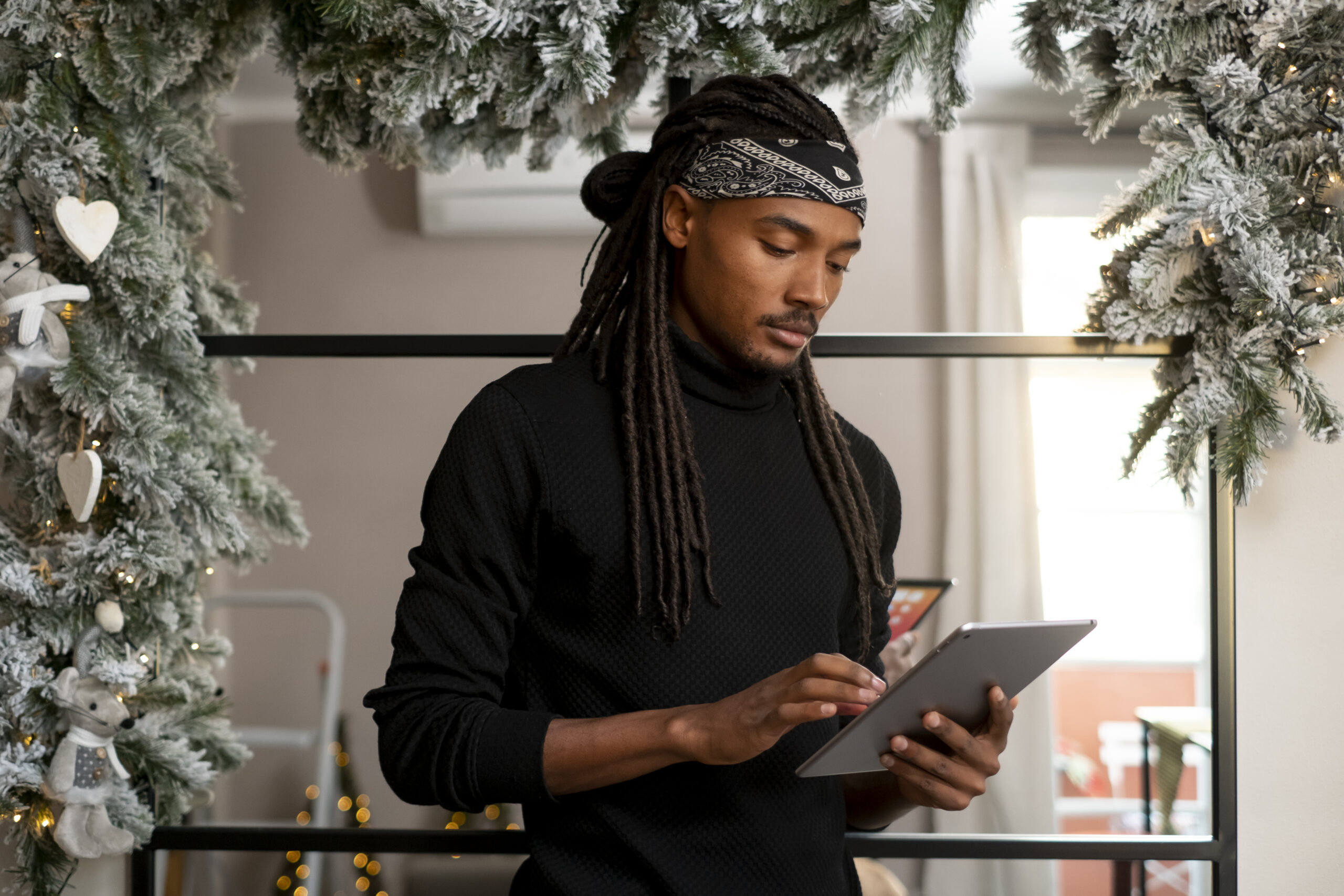 Man holding tablet during the holidays 