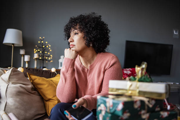 Credit: iStockPhoto - Black Love woman sad during Christmas