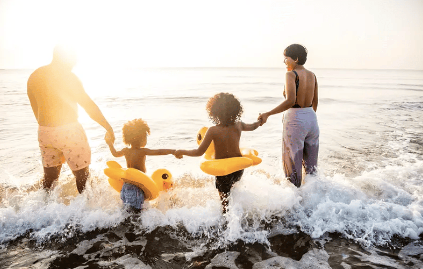 Courtesy of rawpixel.com - Black Love family at the beach during a vacation