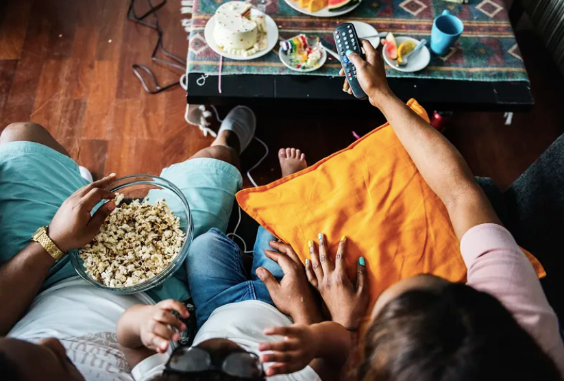 Courtesy of rawpixel.com - Black Love family watching tv or movie