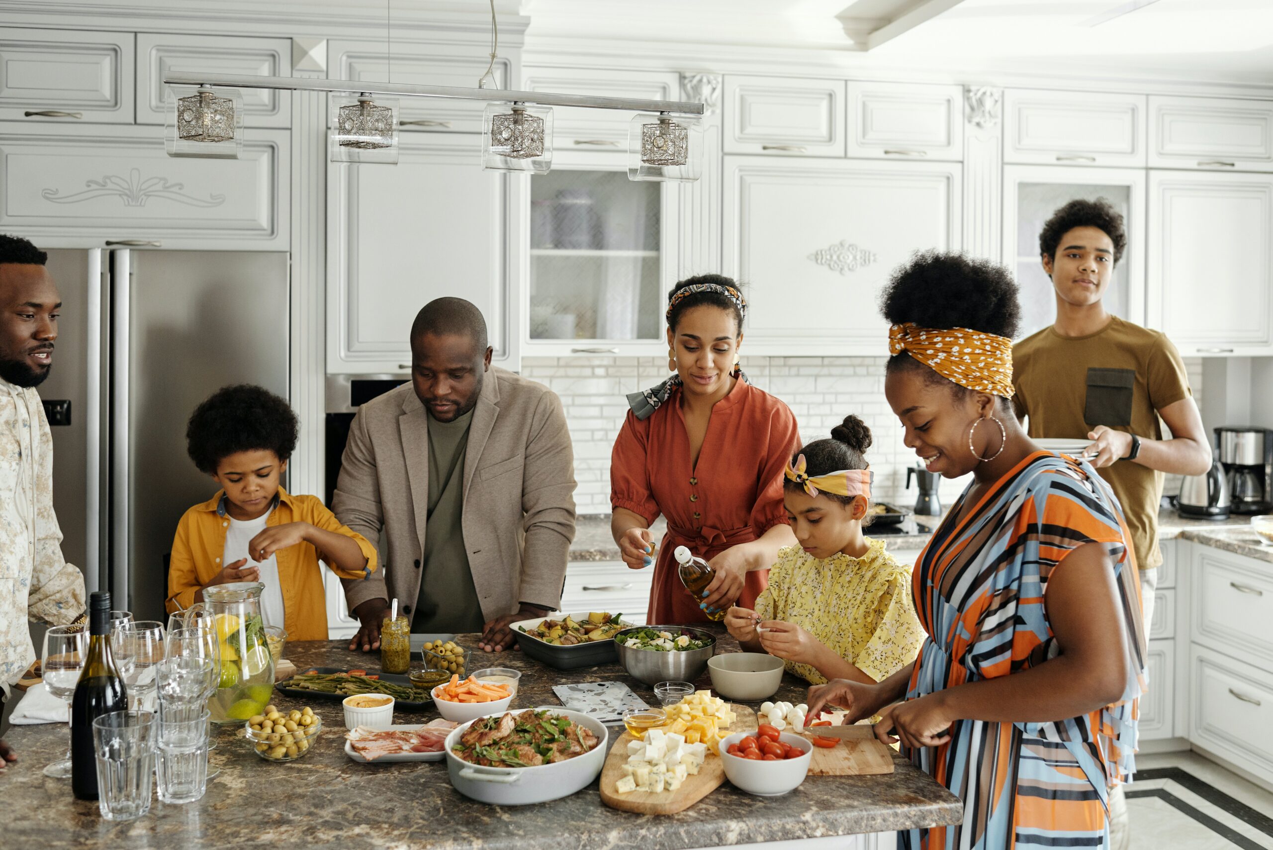 Courtesy of pexels.com - Black Love family cooking in kitchen