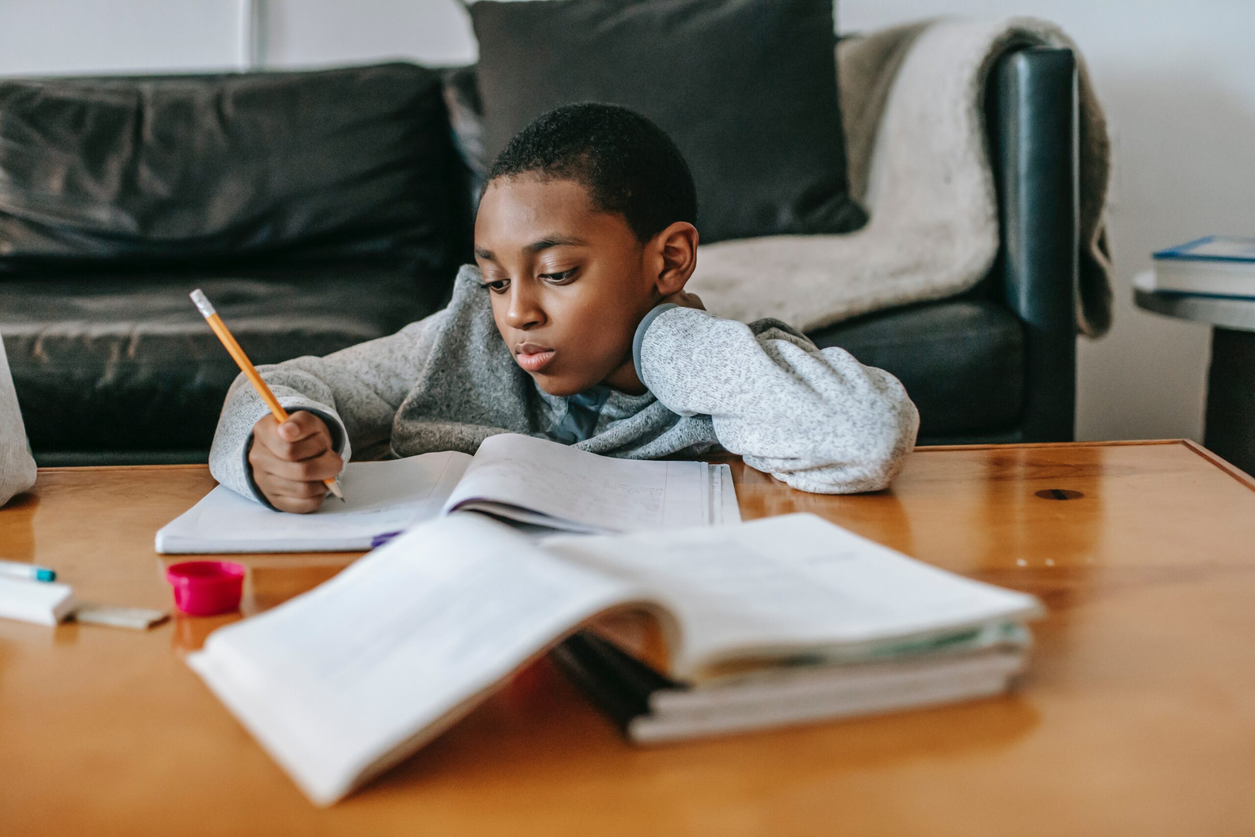 Courtesy of pexels.com - Black Love child doing homework