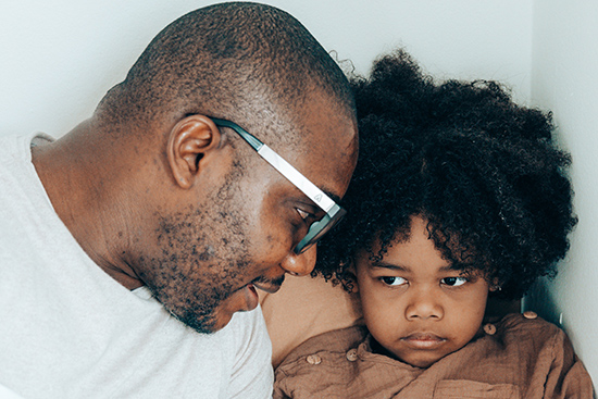 Courtesy of pexels.com - Black Love father talking to son