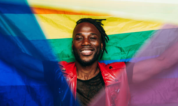 credit: iStock - Black Love man holding gay pride flag