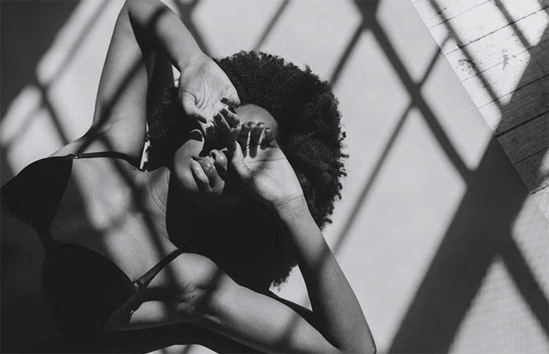 Woman lying on the floor (Courtesy of rawpixel.com) - Black Love Balancing PTSD While Having a Great Sex Life