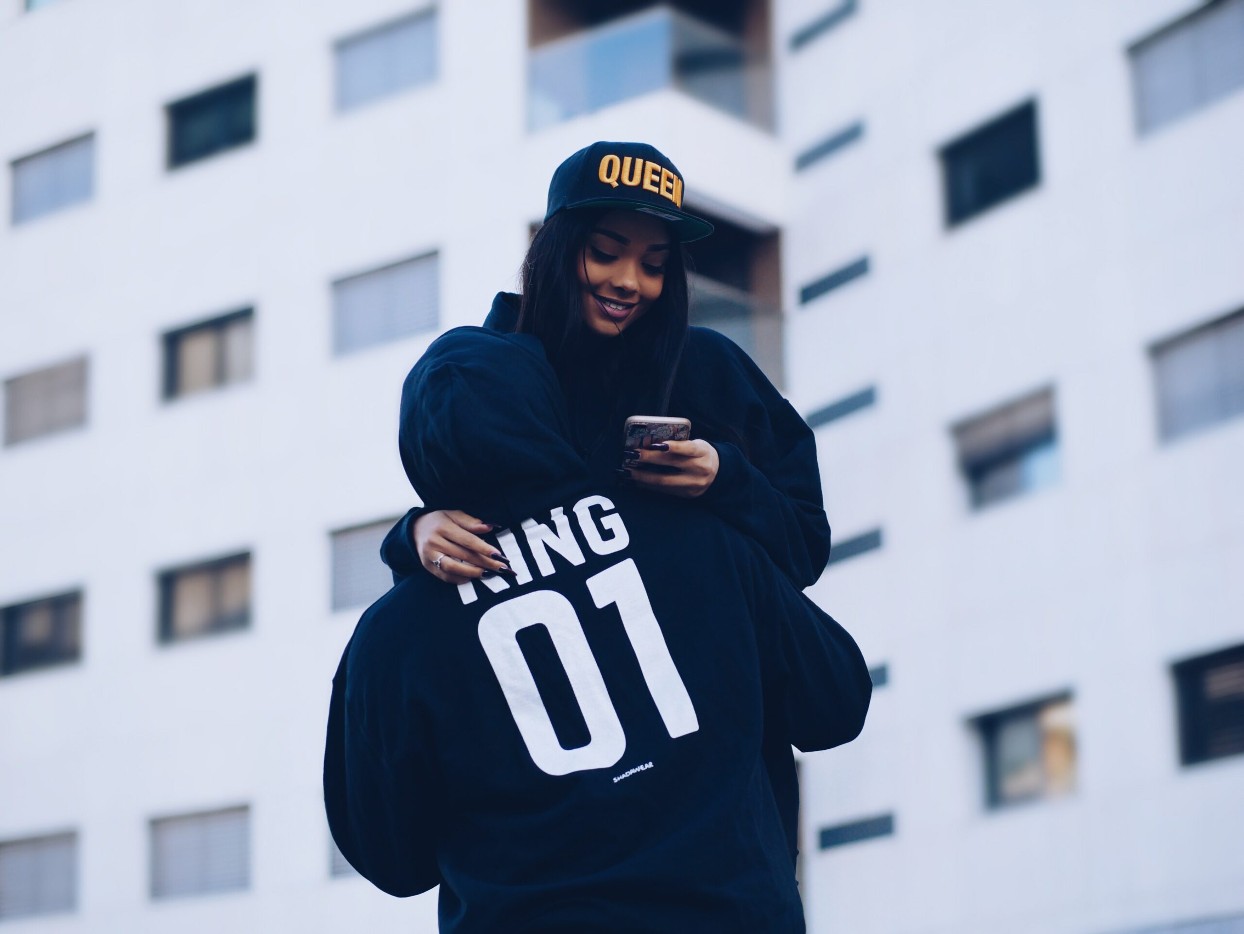 Courtesy of unsplash.com (woman texting) - Black Love
