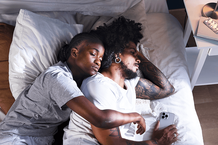Couple hugging in bed (Courtesy of freepik.com) - Black Love