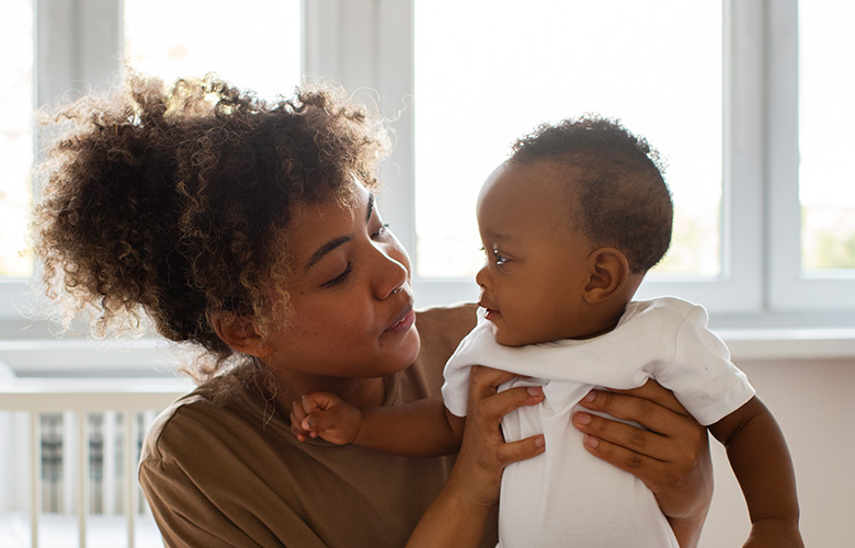 mom holding baby (Courtesy of freepik.com) - Black Love mom holding baby