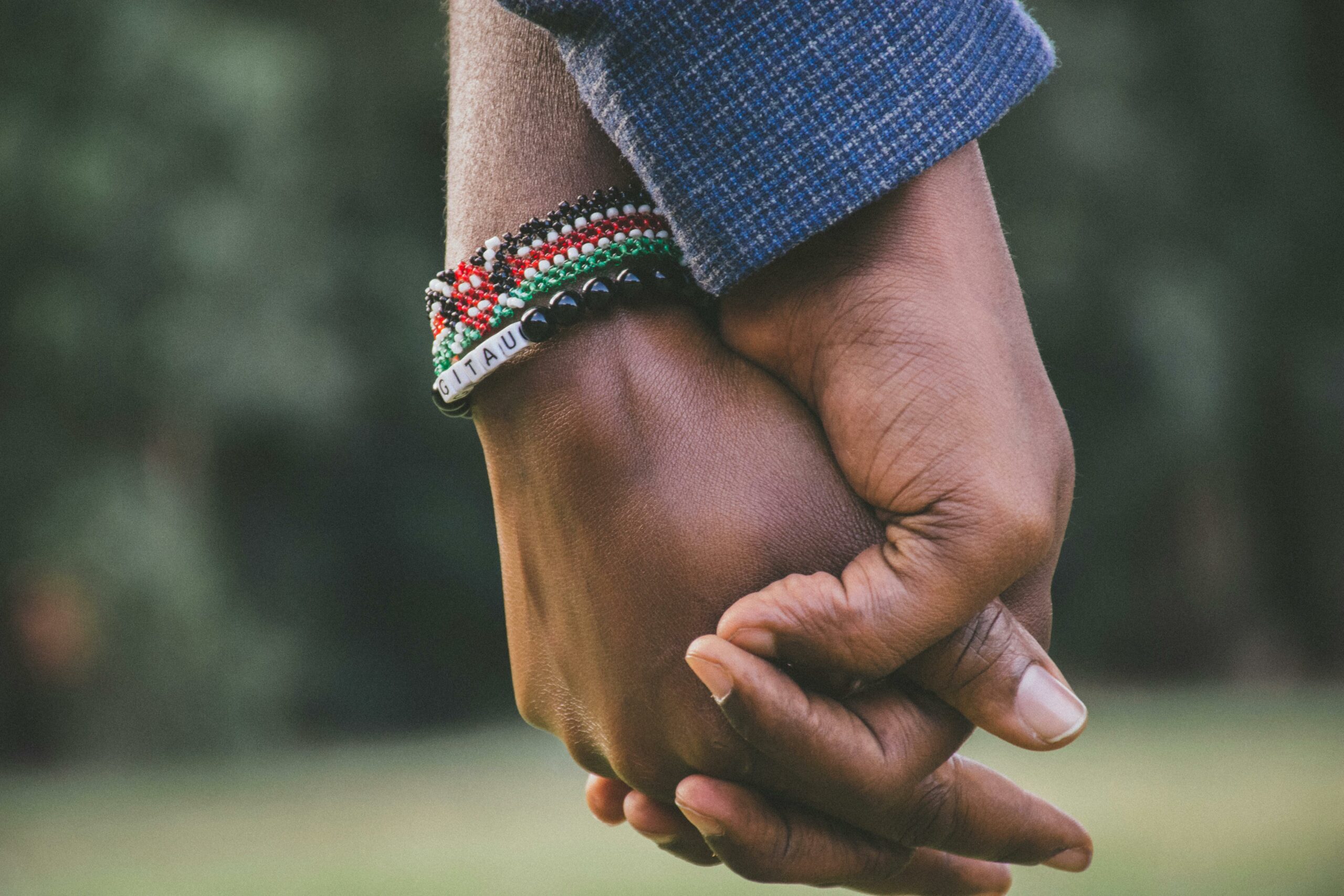 couple holding hands (Courtesy of pexels.com) - Black Love How to Date Based on Your Zodiac Sign: A Black Love Guide