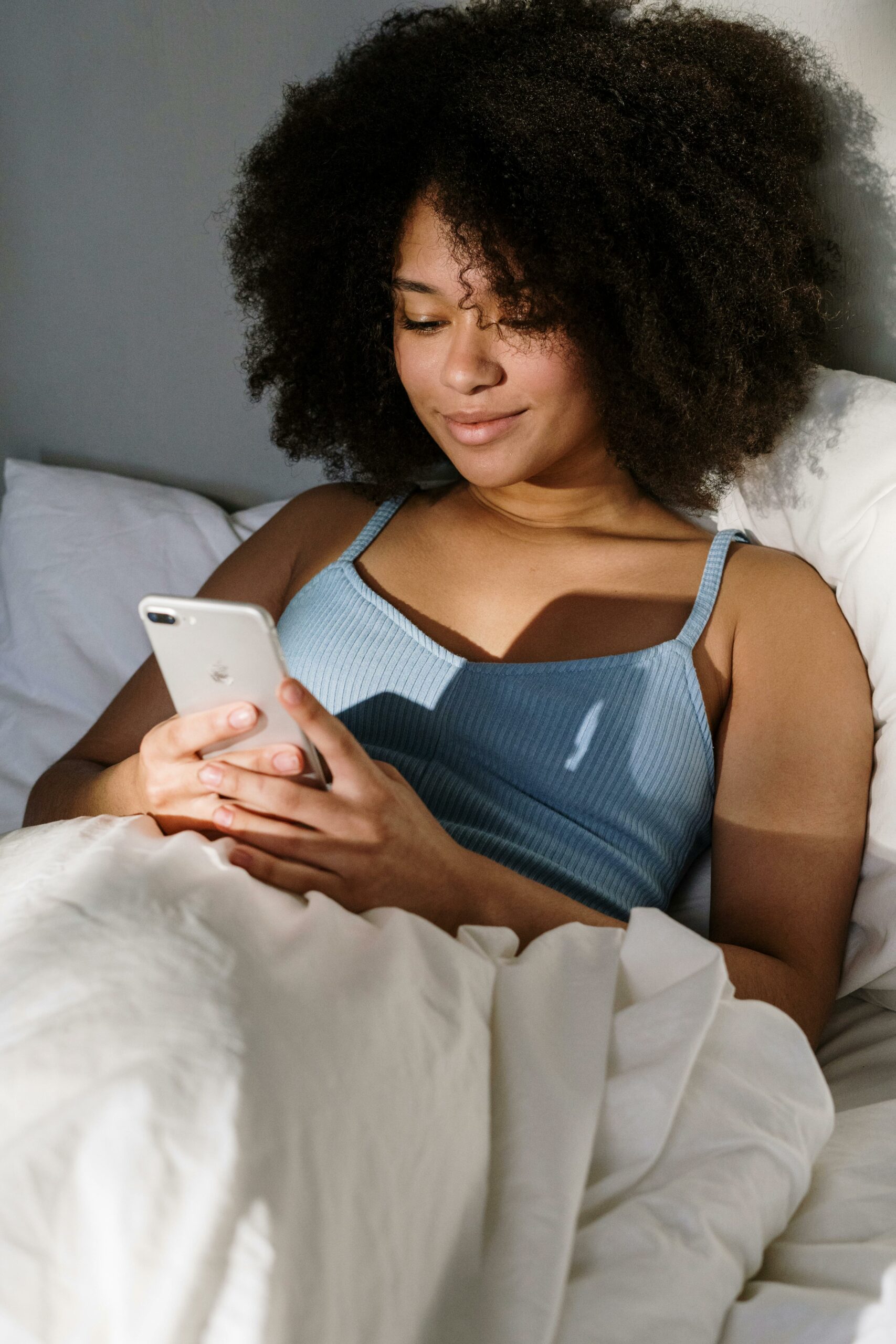 woman on phone (Courtesy of pexels.com) - Black Love How to Find Love in the DMs
