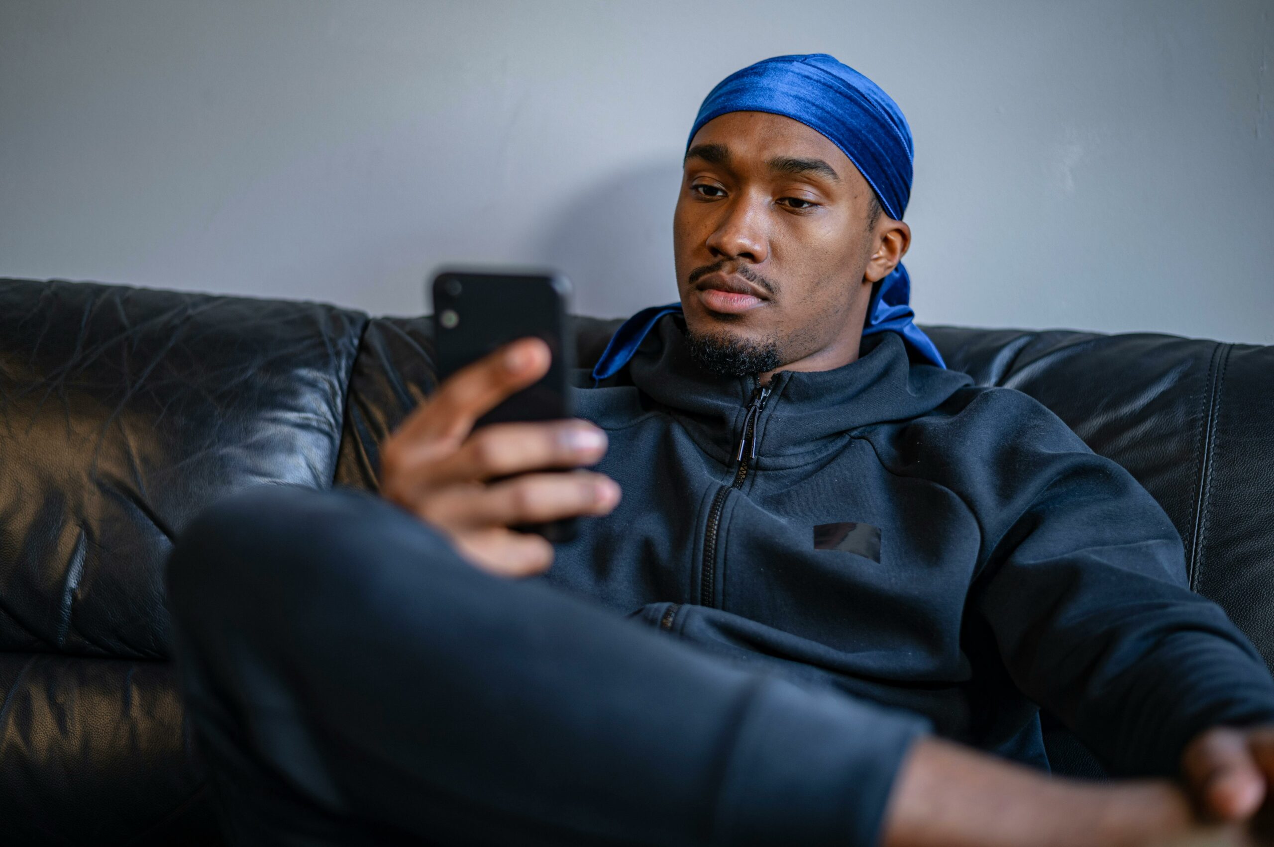man on phone (Courtesy of pexels.com) - Black Love How to Find Love in the DMs